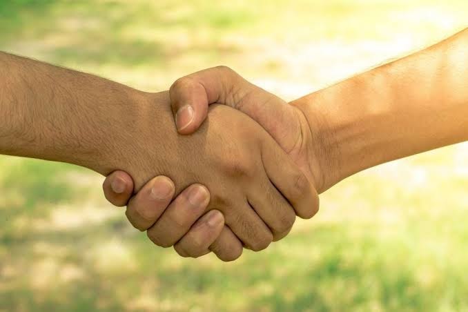 Handshake representing commitment and partnership