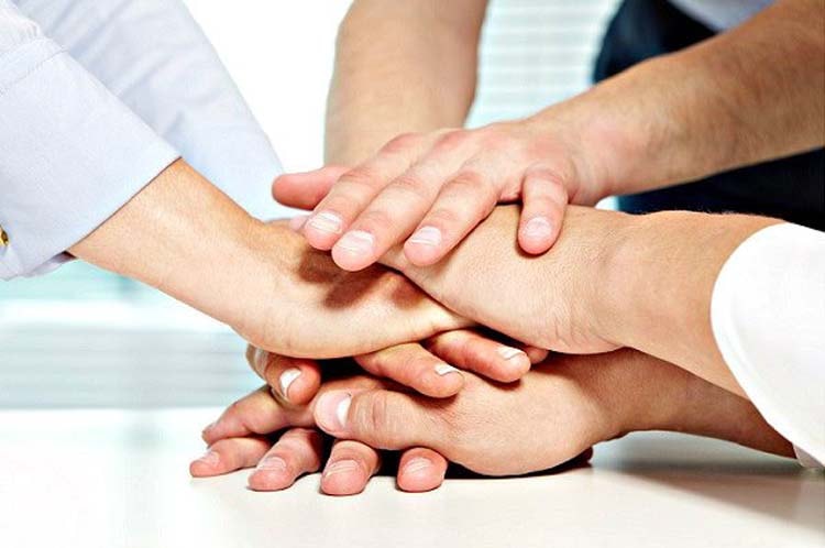 Hands joined together representing integrity and trust