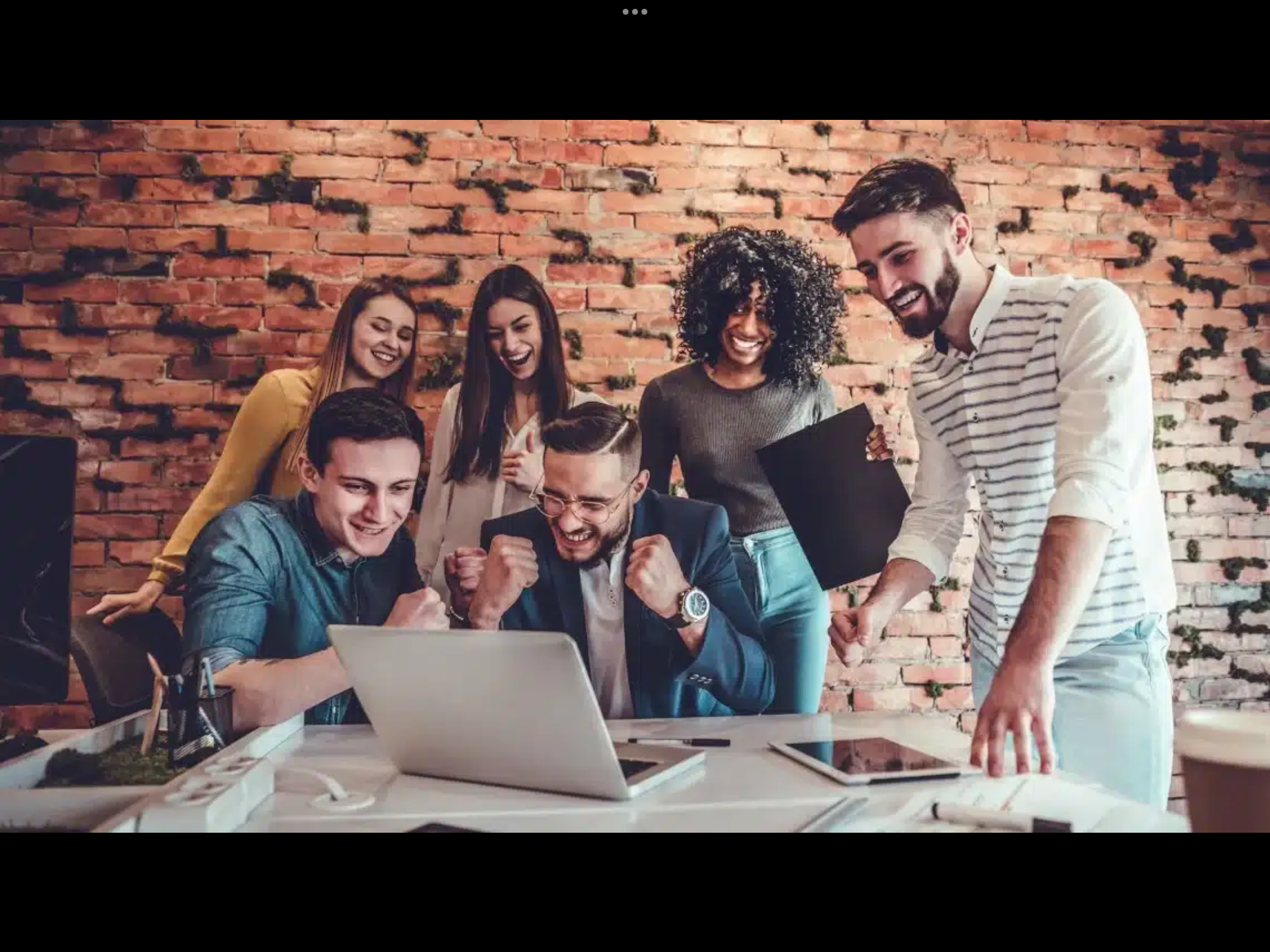 Diverse team celebrating together representing teamwork